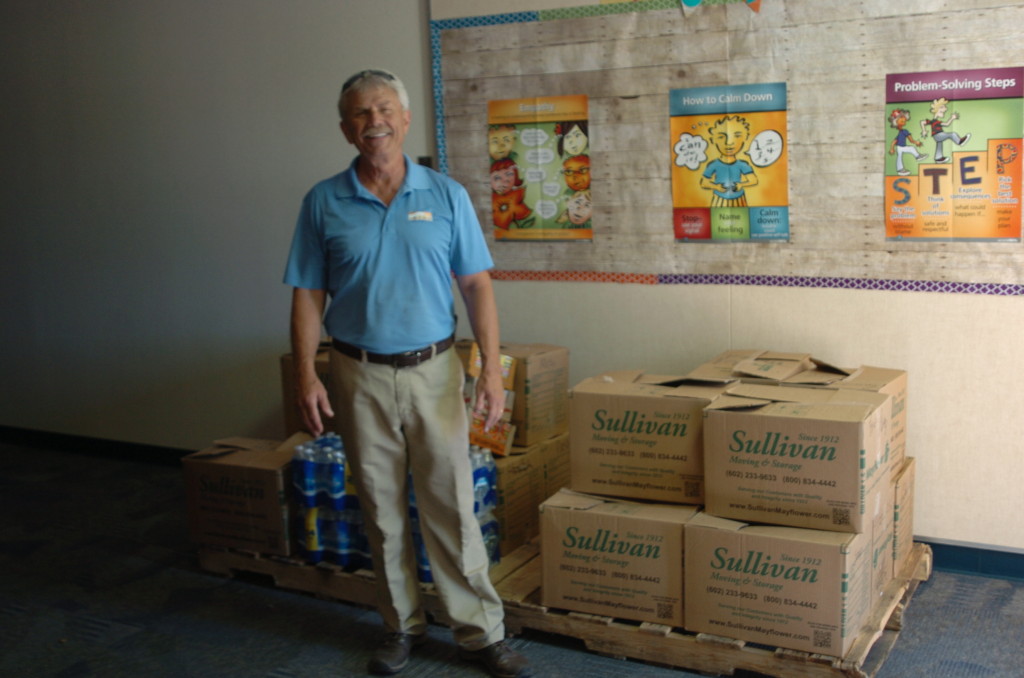 Mark King of King Home Inspections With Food Collected for the Kyrene Foundation