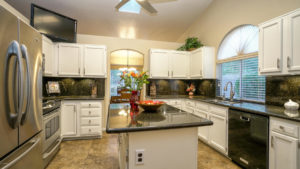 Kitchen with stainless appliances and the refrigerator stays