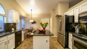 Great kitchen with granite and white cabinets