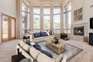 Wall of windows in great room looking out to the mountain preserve