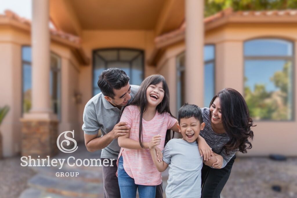 Happy Arizona family in front of their new home