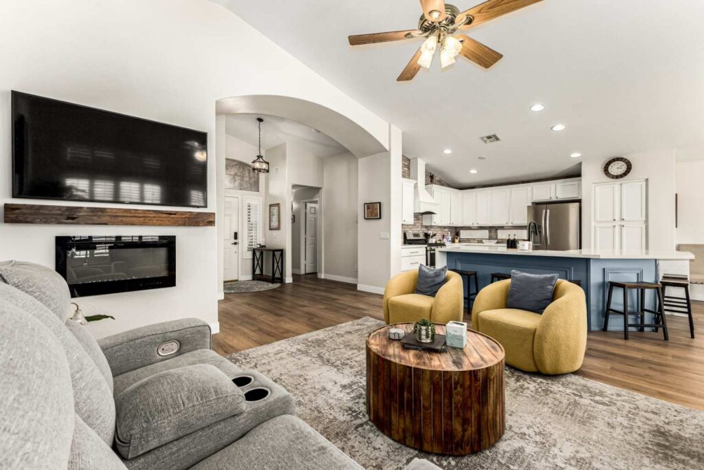 Open concept living room with vaulted ceilings and luxury vinyl plank flooring in Chandler AZ home