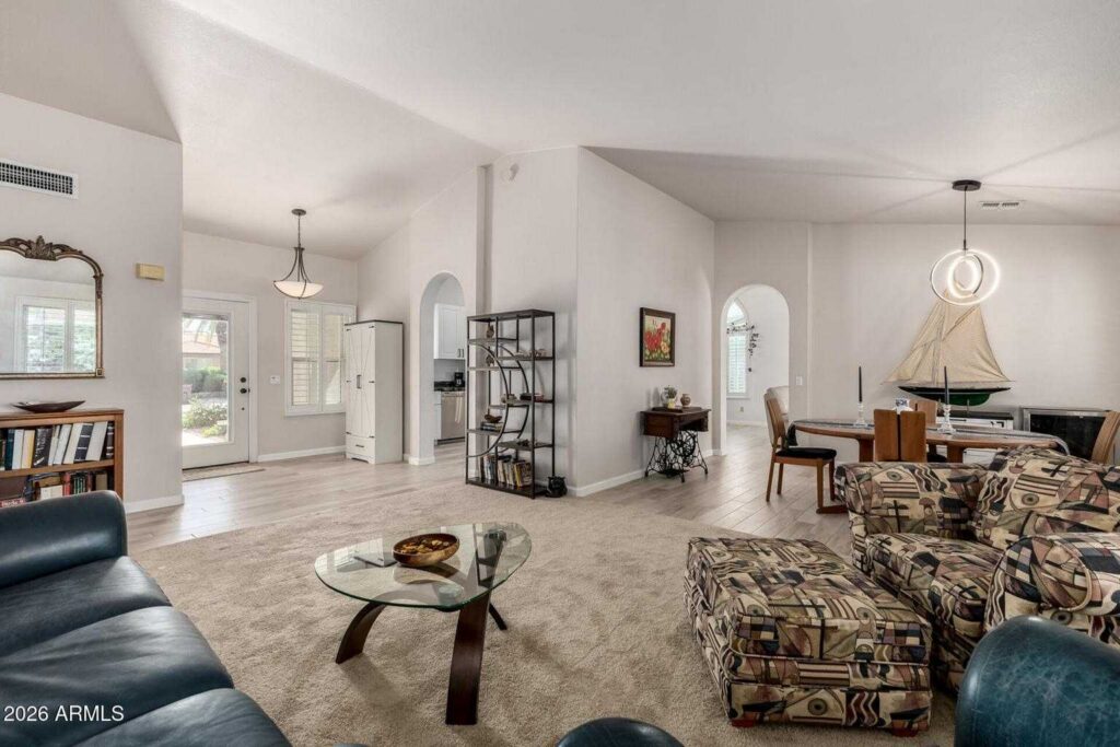 Bright living area in Sun Lakes Arizona home with updated flooring and open layout