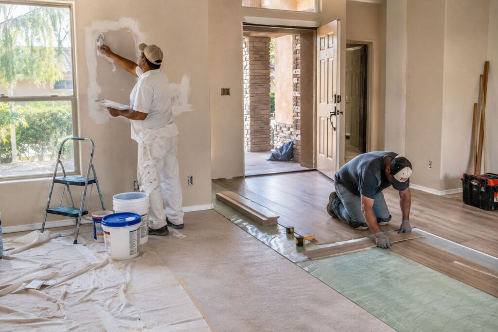 Contractors preparing a rental property for the next tenant after move-out.