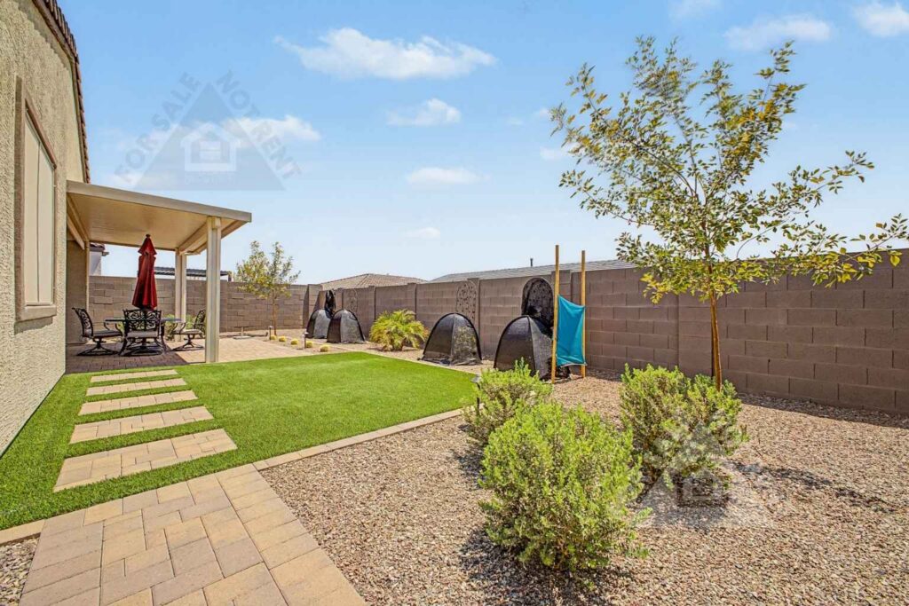 Finished landscaped backyard at 18141 W Hiddenview Drive in Goodyear