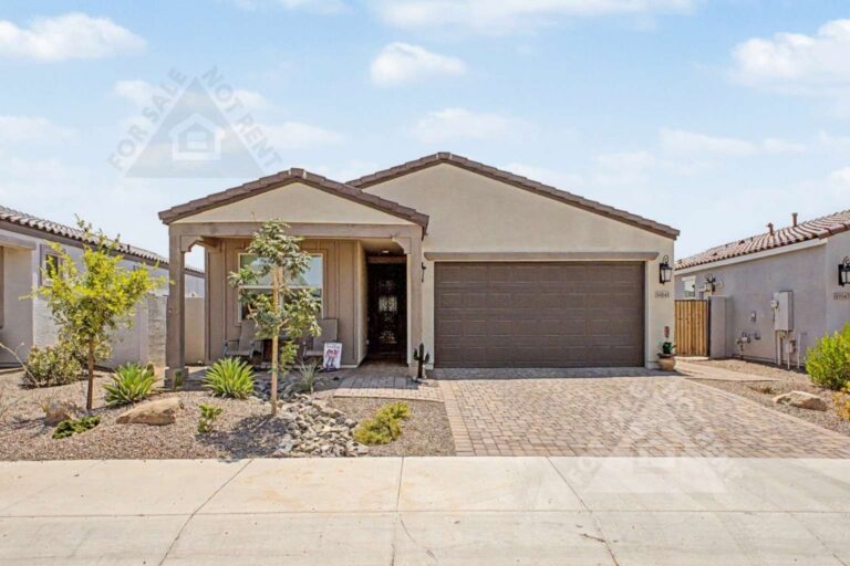 Front exterior of highly upgraded CantaMia home at 18141 W Hiddenview Drive
